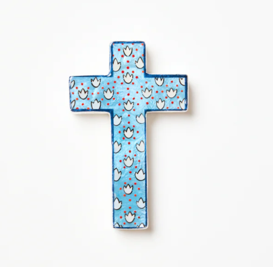Decorative cross with floral pattern on a white background