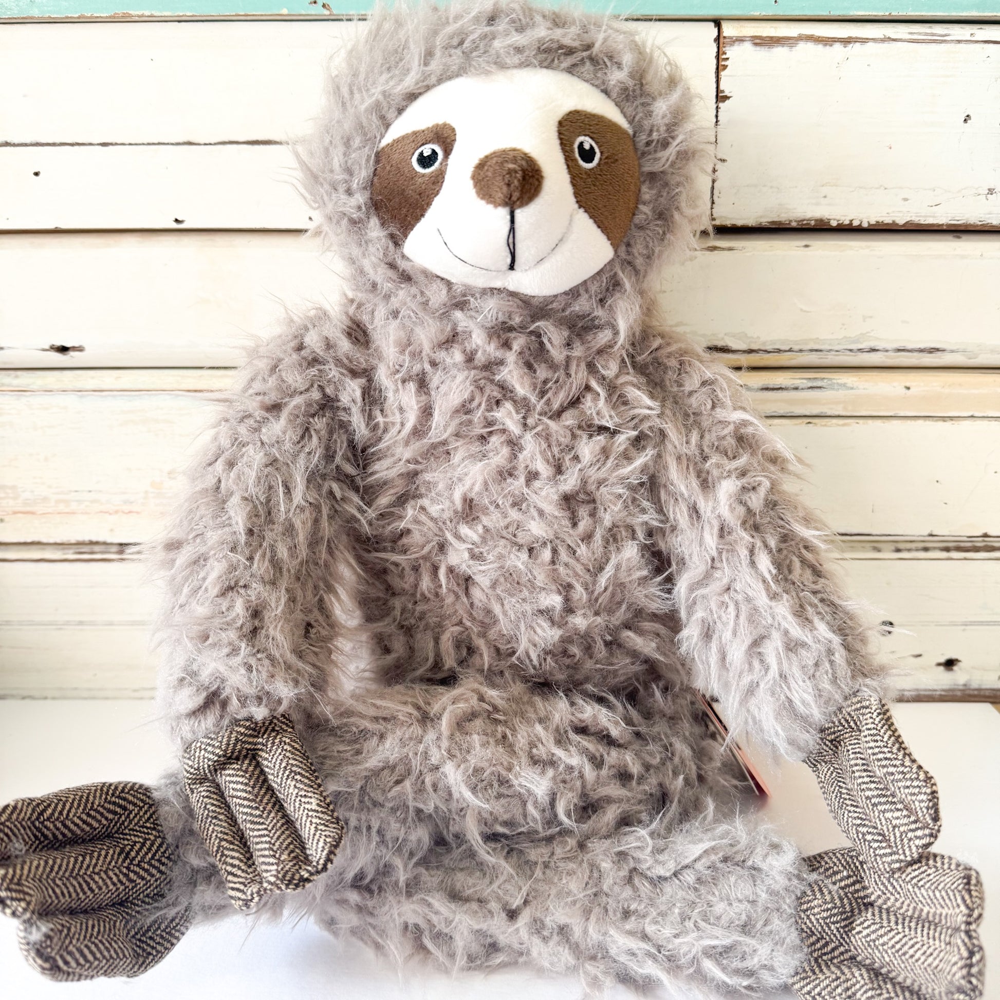 Lily & George - Sofia The Sloth. Plush sloth toy with a smiley face and long arms and legs.
