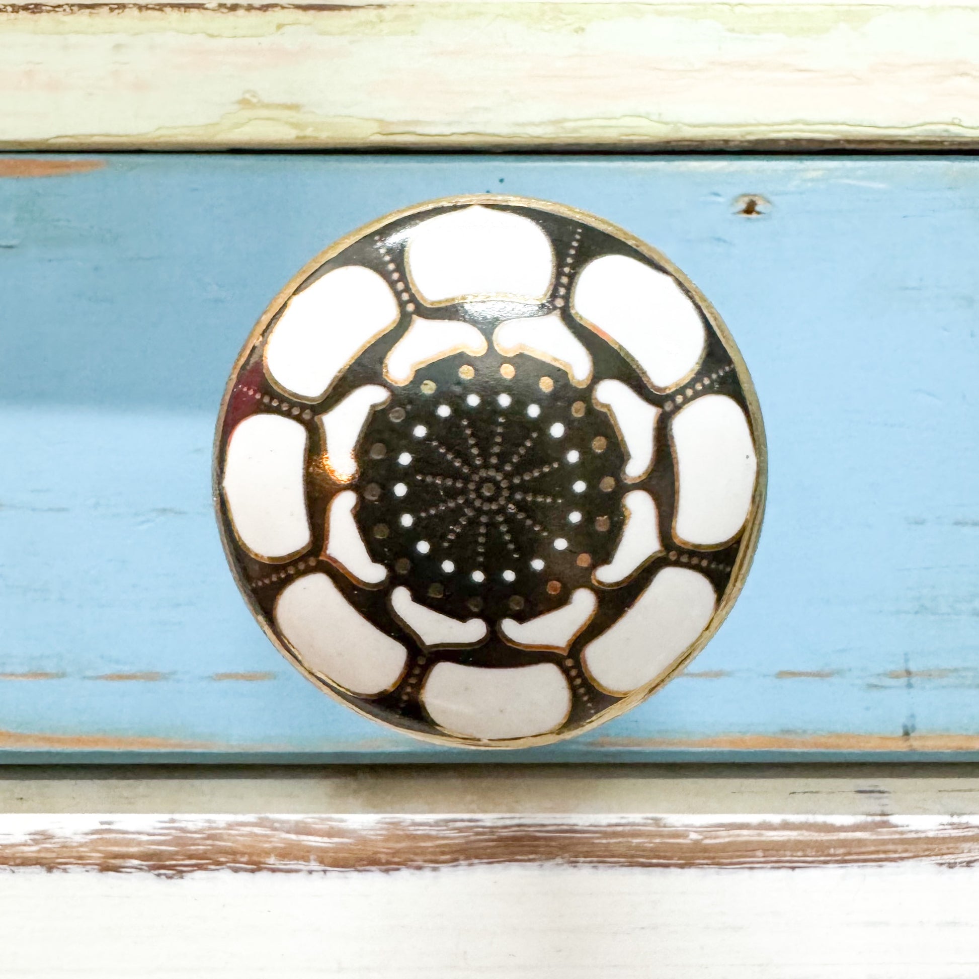 Printed ceramic knob hook in black and white.