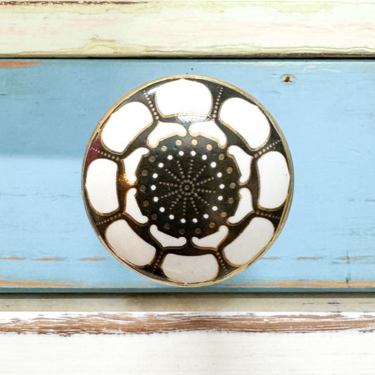 Printed ceramic knob hook in black and white.