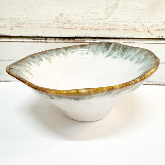 Ceramic bowl with gold rim on a white background