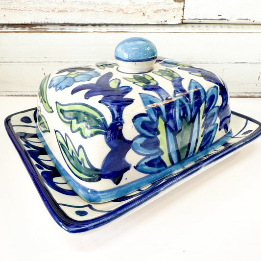 Status Collections - Leafy Blue Butter Dish. Ceramic butter dish with floral design on a white surface