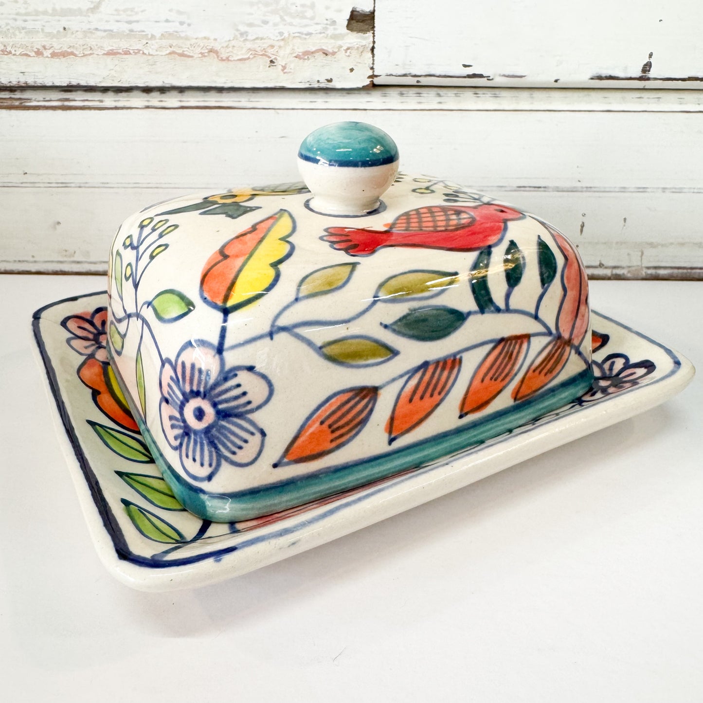 Status Collections - Spring Bird Butter Dish. Ceramic butter dish with floral and bird design on a white background