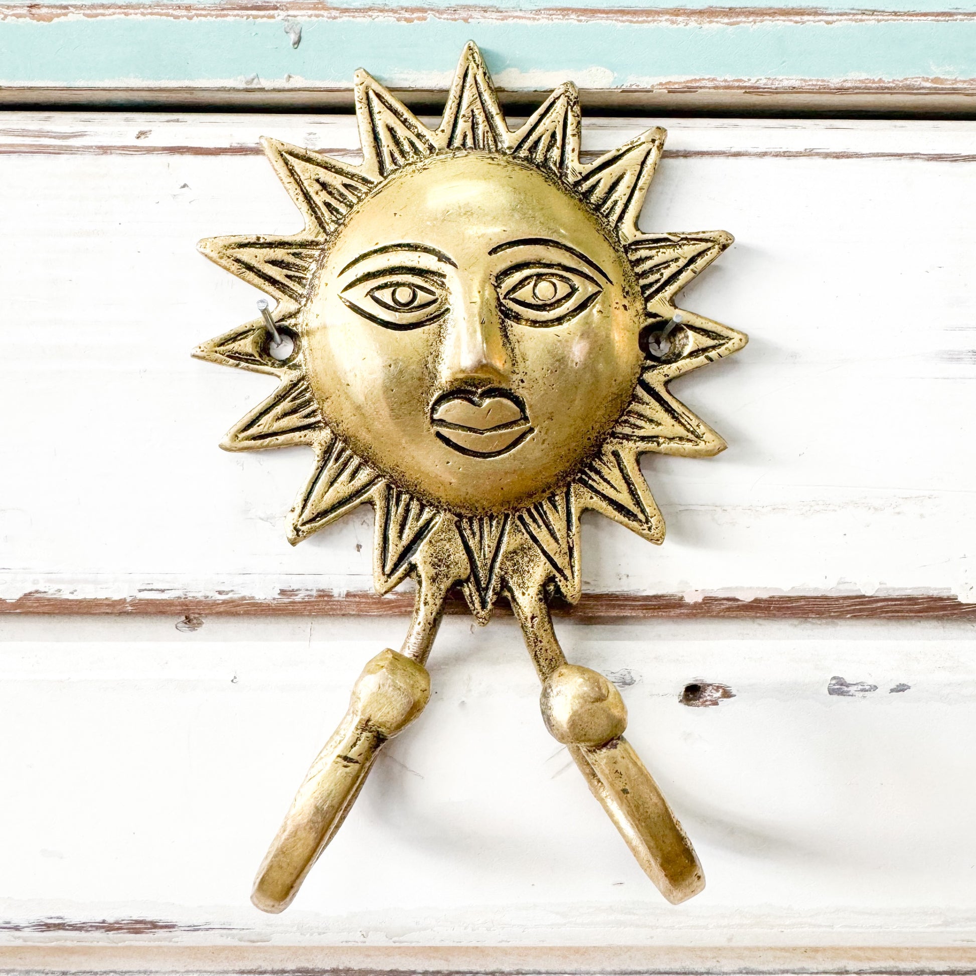 Shiny gold sun with two hooks 