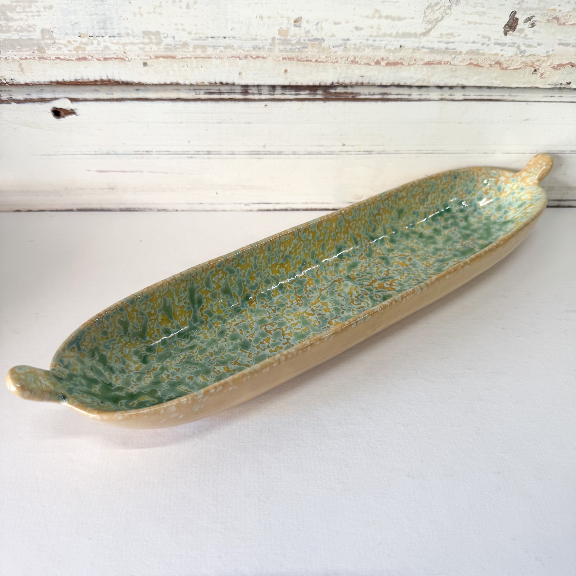 Long green ceramic dish.
The Brightside Store | Citron Server Dish