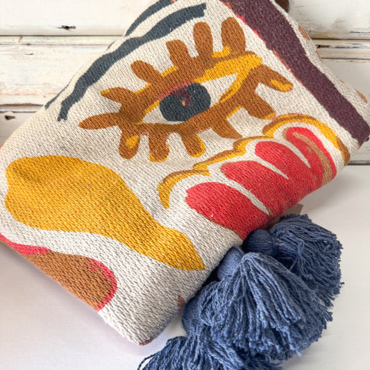 Decorative throw with abstract design and tassels 