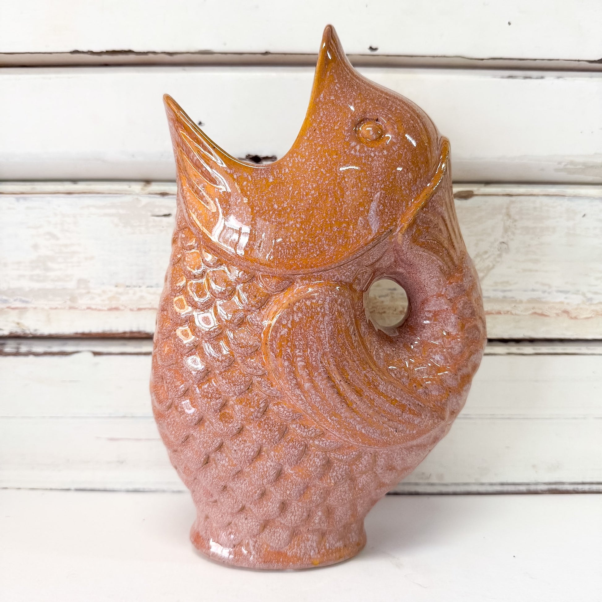 Ceramic fish shaped vase with a textured coral brown finish 