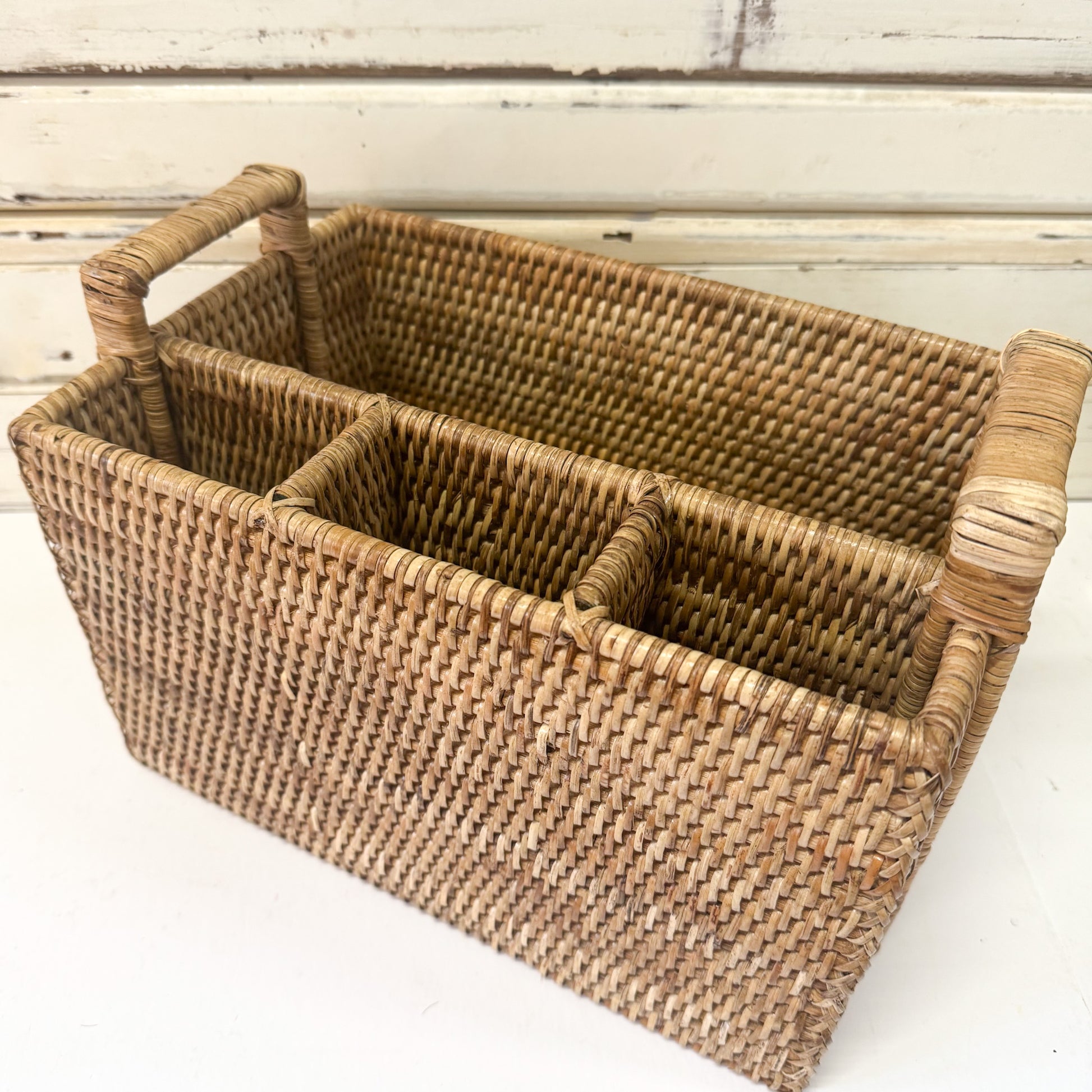 Woven rattan basket with handles 
The Brightside Store | Rattan Cutlery Caddy