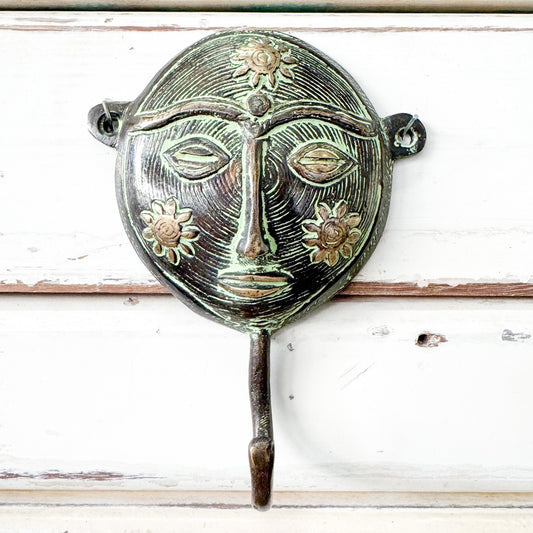 Decorative wall hook with face design and sunflowers 