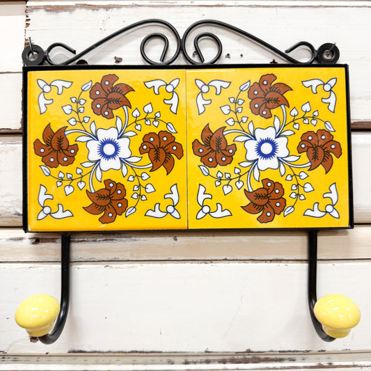 Decorative TILE wall hook with floral design on a yellow background