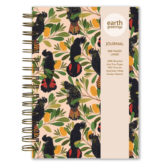 Journal with black cockatoo design on a beige background