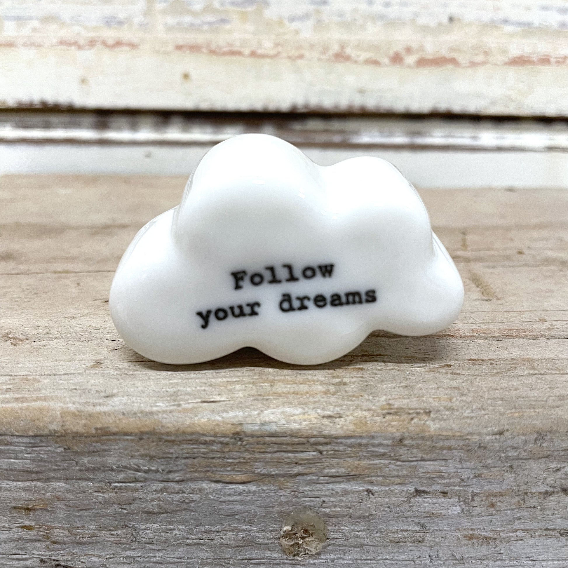 Heaven in Earth - Follow Your Dreams Porcelain Cloud. A white porcelain cloud ornament with the inscription 'Follow your dreams
