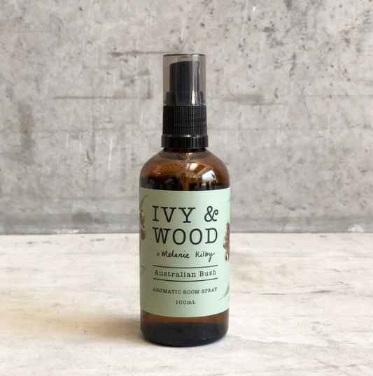 A brown bottle of Ivy & Wood Australian Bush aromatic room spray with a green label, Ivy & Wood - Australian Bush Room Spray