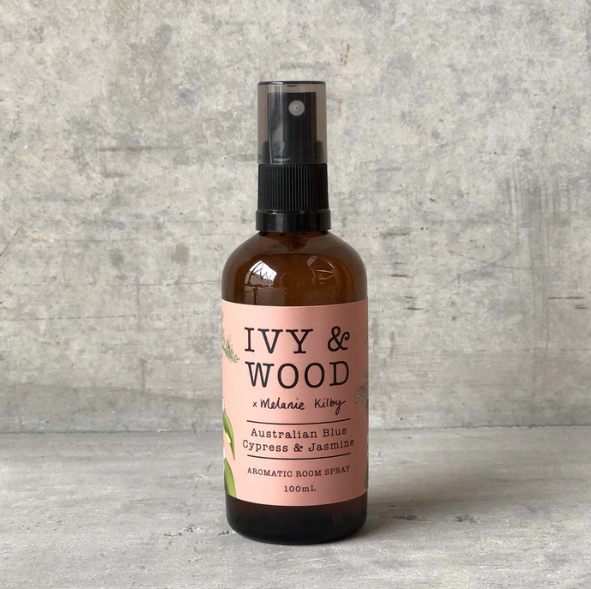 A bottle of Ivy & Wood room spray with Blue Cypress & Jasmine label, 